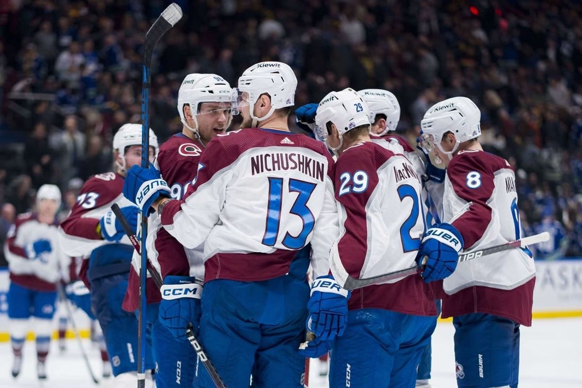 Mar 13, 2024; Vancouver, British Columbia, CAN; Colorado Avalanche forward Mikko Rantanen (96) and forward Valeri Nichushkin (13) and forward Nathan MacKinnon (29) and defenseman Cale Makar (8) celebrate MacKinnon   s game winning overtime goal against the Vancouver Canucks Rogers Arena. Colorado won 4 -3 in overtime.