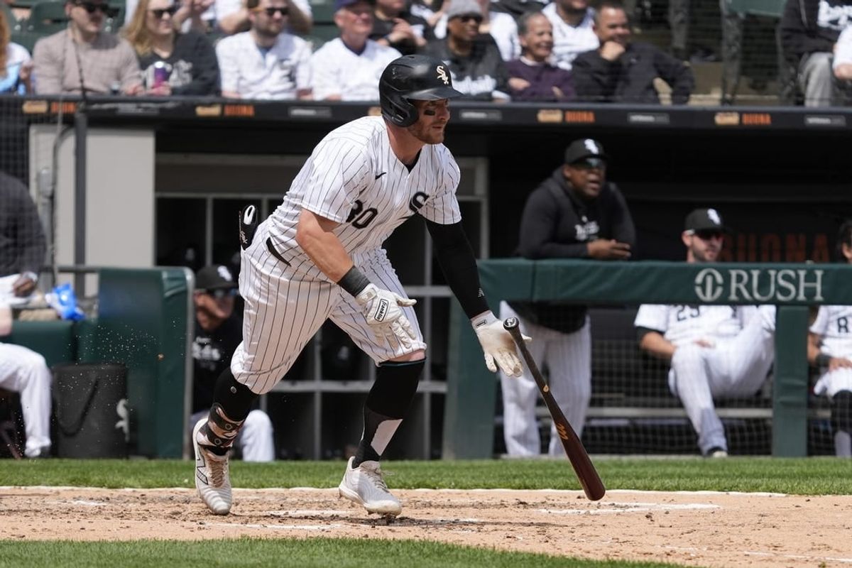 Apr 28, 2024; Chicago, Illinois, USA; Chicago White Sox outfielder Robbie Grossman (30) hits a one run single against the Tampa Bay Rays during the fourth inning at Guaranteed Rate Field.