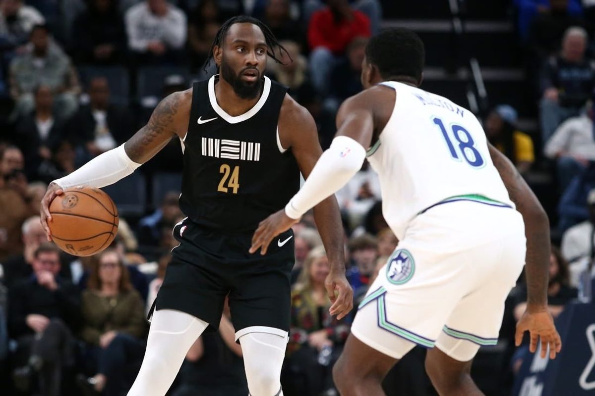 Dec 8, 2023; Memphis, Tennessee, USA; Memphis Grizzlies guard Jaylen Nowell (24) dribbles as Minnesota Timberwolves guard-forward Shake Milton (18) defends during the second half at FedExForum.