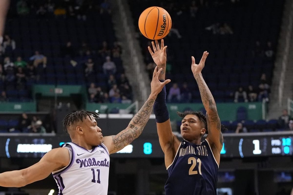 Mar 17, 2023; Greensboro, NC, USA; Montana State Bobcats guard RaeQuan Battle (21) shoots against Kansas State Wildcats forward Keyontae Johnson (11) in the second half at Greensboro Coliseum.