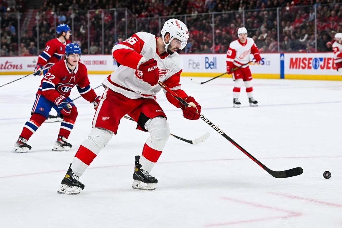 Dec 2, 2023; Montreal, Quebec, CAN; Detroit Red Wings defenseman Jake Walman (96) plays the puck against the Montreal Canadiens during the third period at Bell Centre.