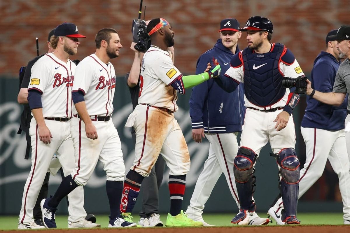 Apr 24, 2024; Atlanta, Georgia, USA; Atlanta Braves center fielder Michael Harris II (23) celebrates after a walk-off double with catcher Travis d'Arnaud (16) against the Miami Marlins at Truist Park.