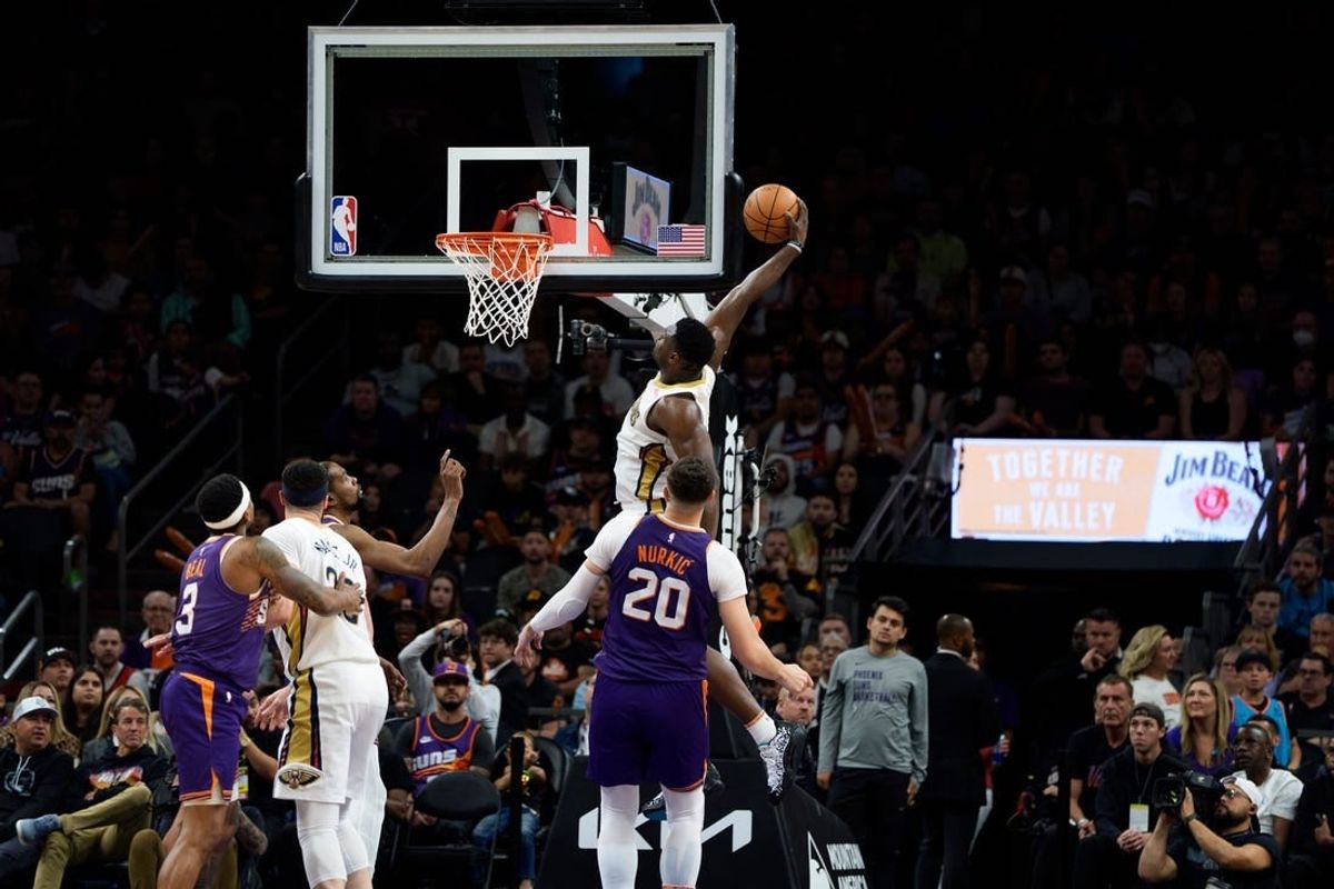 Apr 7, 2024; Phoenix, Arizona, USA;  New Orleans Pelicans forward Zion Williamson (1) dunks to score against the Phoenix Suns in the second half at Footprint Center.