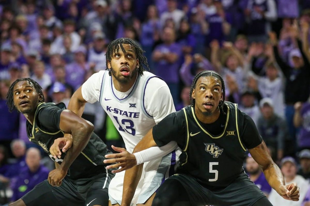 Jan 6, 2024; Manhattan, Kansas, USA; UCF Knights forwards Omar Payne (5) and Marchelus Avery (13) block out Kansas State Wildcats center Will McNair Jr. (13) for a rebound during the first half at Bramlage Coliseum.