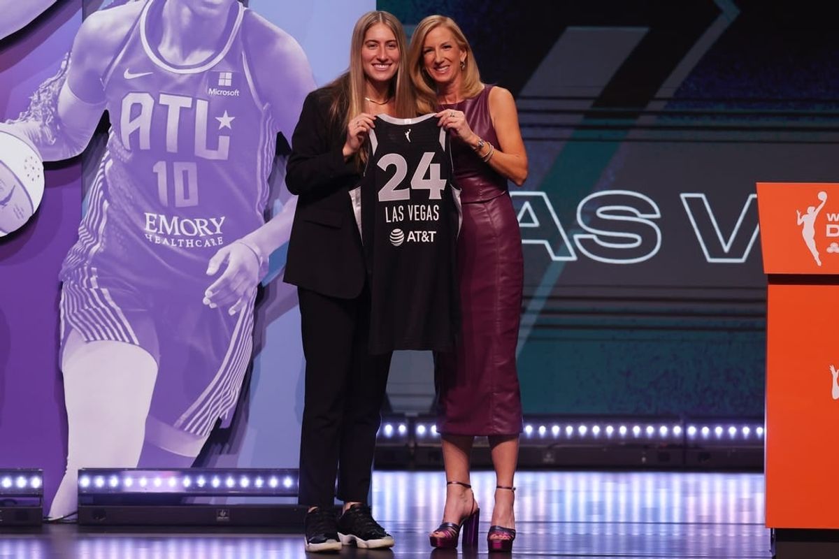 Apr 15, 2024; Brooklyn, NY, USA; Kate Martin poses with WNBA commissioner Cathy Engelbert after being selected with the number eighteen overall pick to the Las Vegas Aces in the 2024 WNBA Draft at Brooklyn Academy of Music.