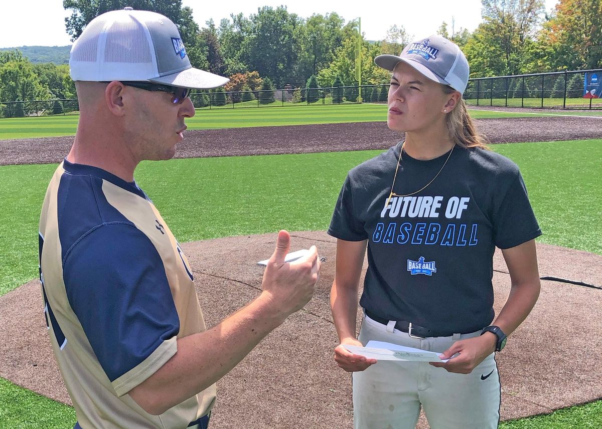 Coach Scott Kushner and Mary Schoenke talk over a few things.