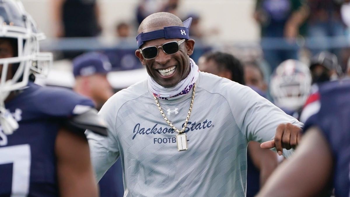 Jackson State football coach Deion Sanders  greets his defensive squad after they recovered a Mississippi Valley State fumble for a touchdown in March, 2021.