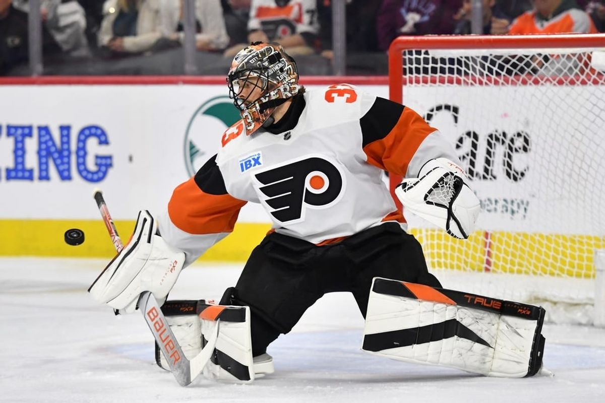Apr 1, 2024; Philadelphia, Pennsylvania, USA; Philadelphia Flyers goaltender Samuel Ersson (33) makes a save during the first period against the New York Islanders at Wells Fargo Center.