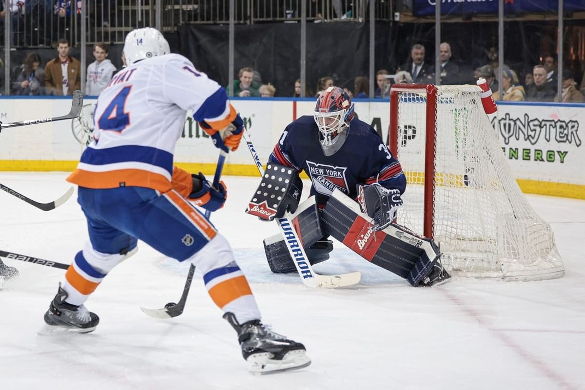 Mar 17, 2024; New York, New York, USA; New York Rangers goaltender Igor Shesterkin (31) defends the goal against New York Islanders center Bo Horvat (14) during the first period at Madison Square Garden.