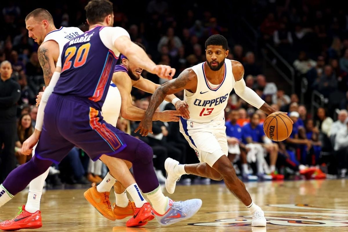 Jan 3, 2024; Phoenix, Arizona, USA; LA Clippers forward Paul George (13) drives to the basket during the second quarter against the Phoenix Suns at Footprint Center.