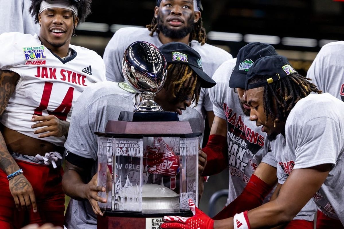 Dec 16, 2023; New Orleans, LA, USA;  Jacksonville State Gamecocks hold up the game trophy after the game against the Louisiana-Lafayette Ragin Cajuns at the Caesars Superdome.