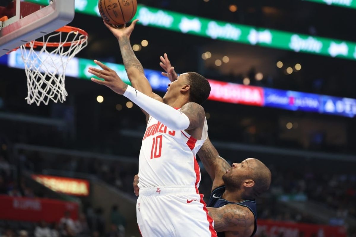 Nov 17, 2023; Los Angeles, California, USA;  Houston Rockets forward Jabari Smith Jr. (10) goes to the basket past L.A. Clippers forward P.J. Tucker (17) during the second quarter at Crypto.com Arena.