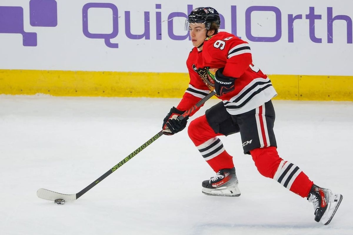 Nov 26, 2023; Chicago, Illinois, USA; Chicago Blackhawks center Connor Bedard (98) skates with the puck against the St. Louis Blues during the first period at United Center.