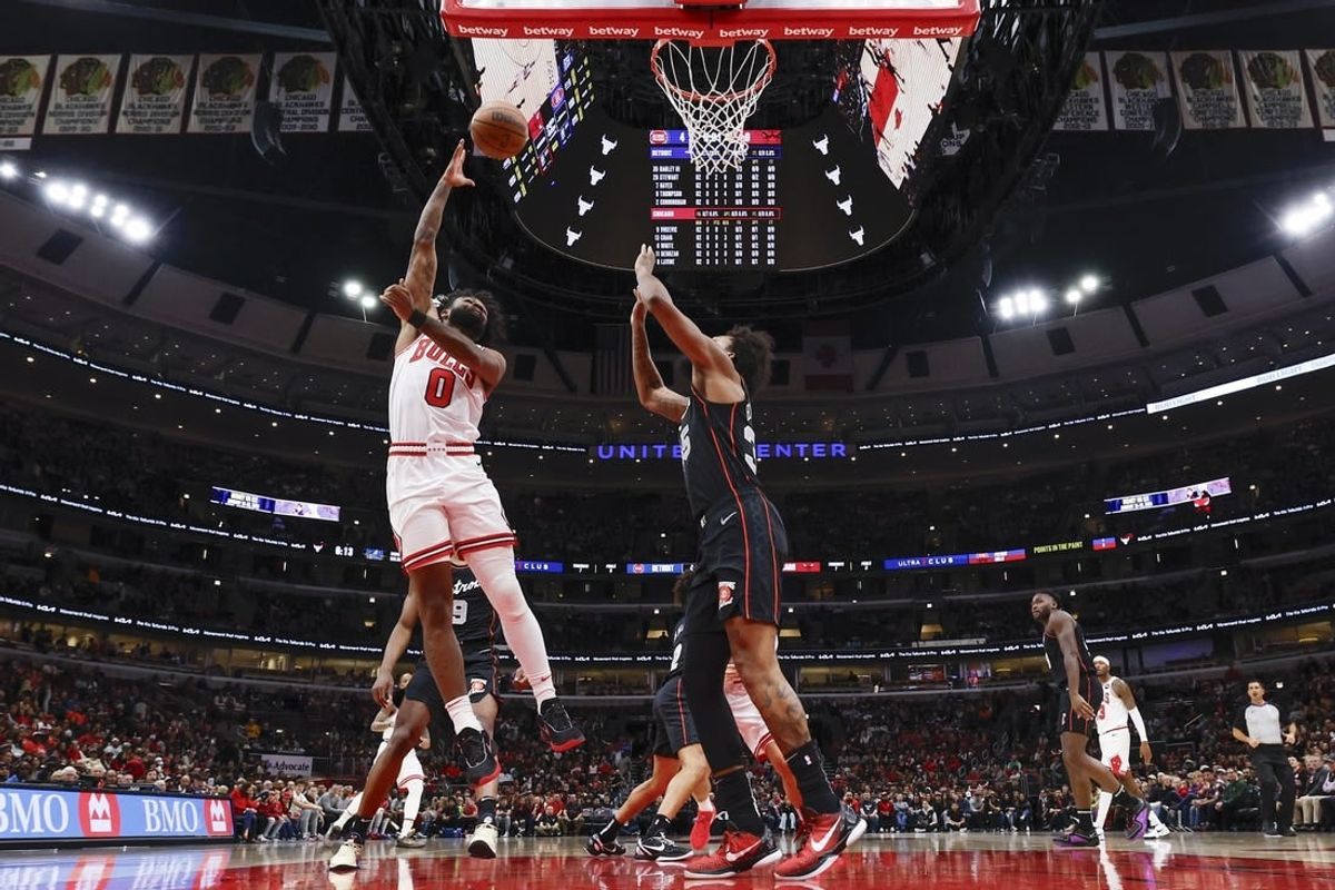 Nov 12, 2023; Chicago, Illinois, USA; Chicago Bulls guard Coby White (0) goes to the basket against Detroit Pistons forward Marvin Bagley III (35) during the first half at United Center.