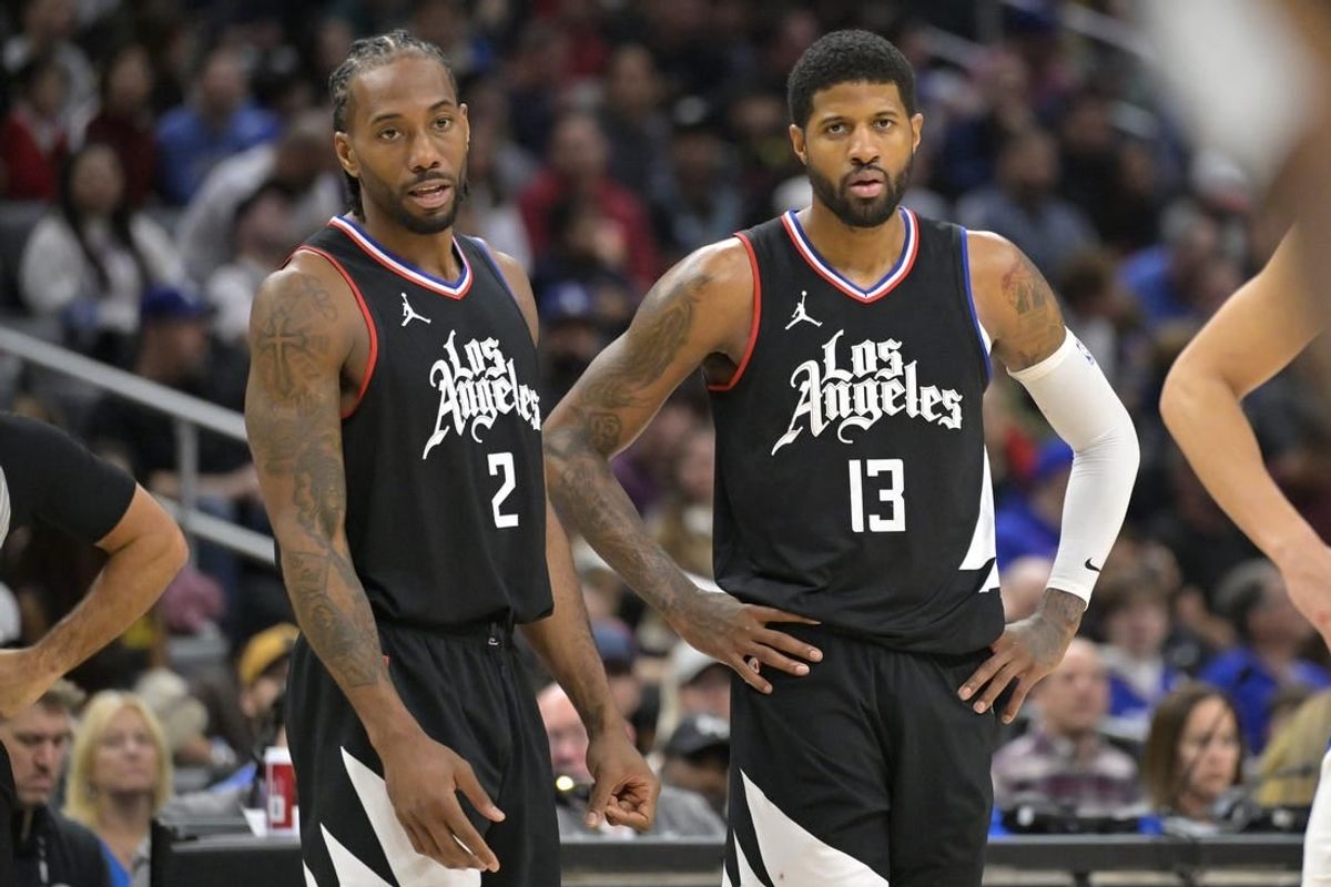 Feb 10, 2024; Los Angeles, California, USA;   Los Angeles Clippers forward Kawhi Leonard (2) and forward Paul George (13) look on in the second half against the Detroit Pistons at Crypto.com Arena.