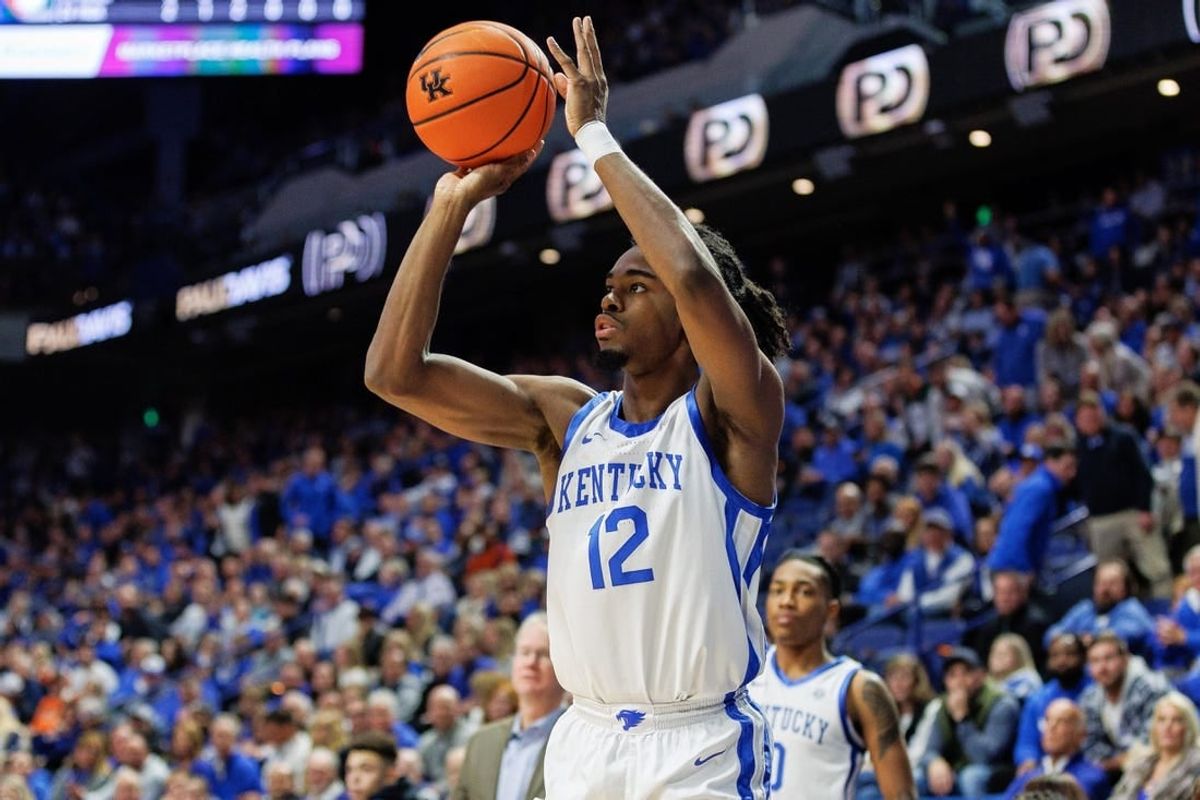 Nov 28, 2023; Lexington, Kentucky, USA; Kentucky Wildcats guard Antonio Reeves (12) shoots the ball during the second half against the Miami (Fl) Hurricanes at Rupp Arena at Central Bank Center.
