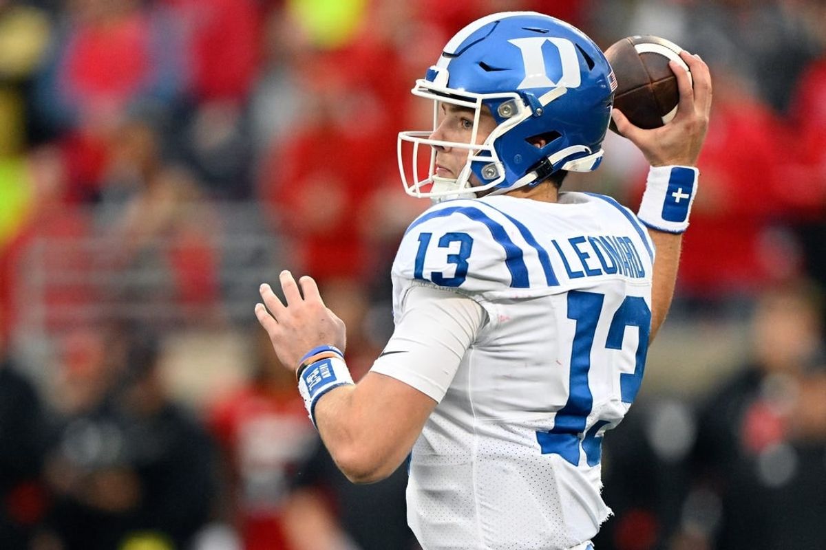 Oct 28, 2023; Louisville, Kentucky, USA;  Duke Blue Devils quarterback Riley Leonard (13) looks to pass the ball against the Louisville Cardinals during the second half at L&N Federal Credit Union Stadium.