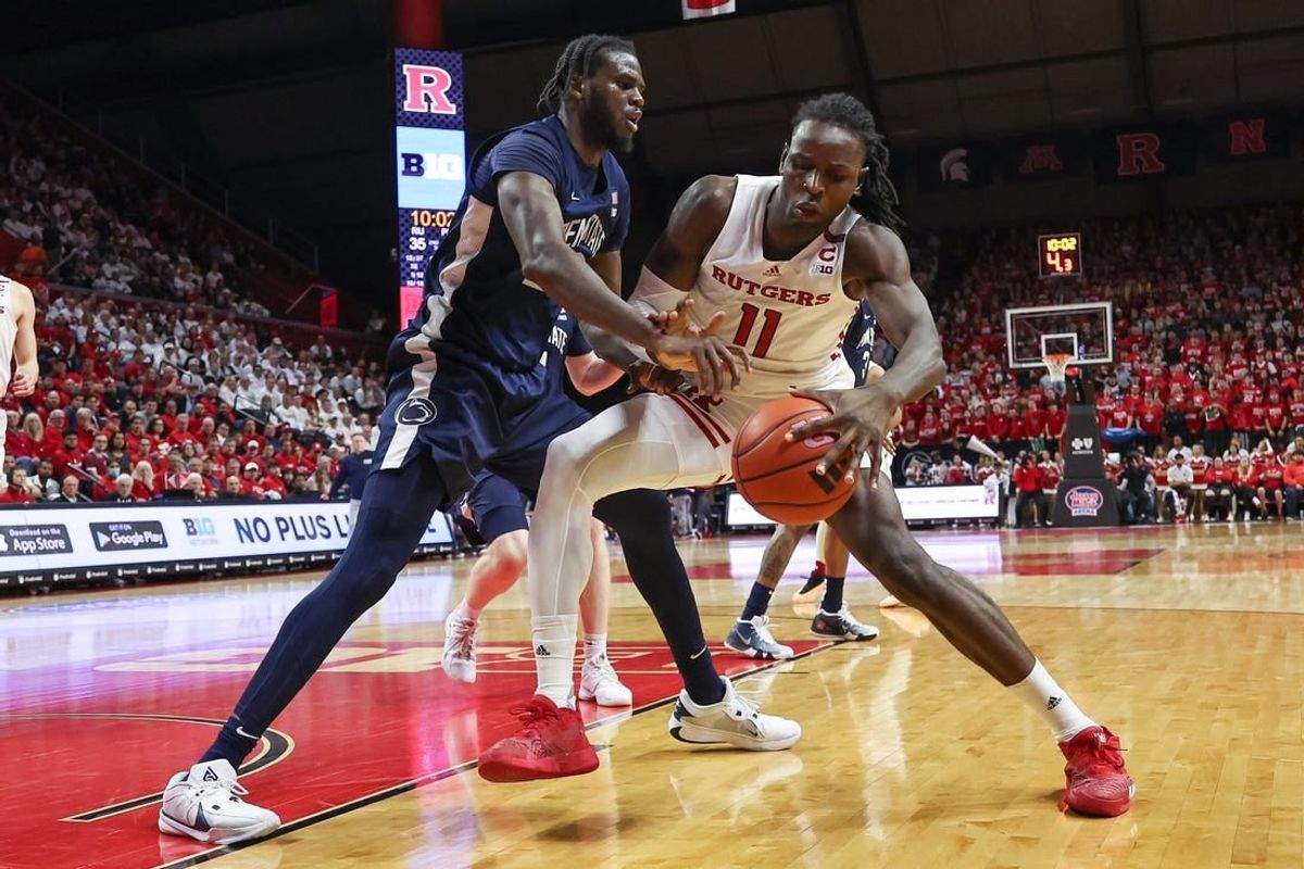 Jan 31, 2024; Piscataway, New Jersey, USA; Rutgers Scarlet Knights center Clifford Omoruyi (11) dribbles against Penn State Nittany Lions forward Qudus Wahab (22) during the second half at Jersey Mike's Arena.
