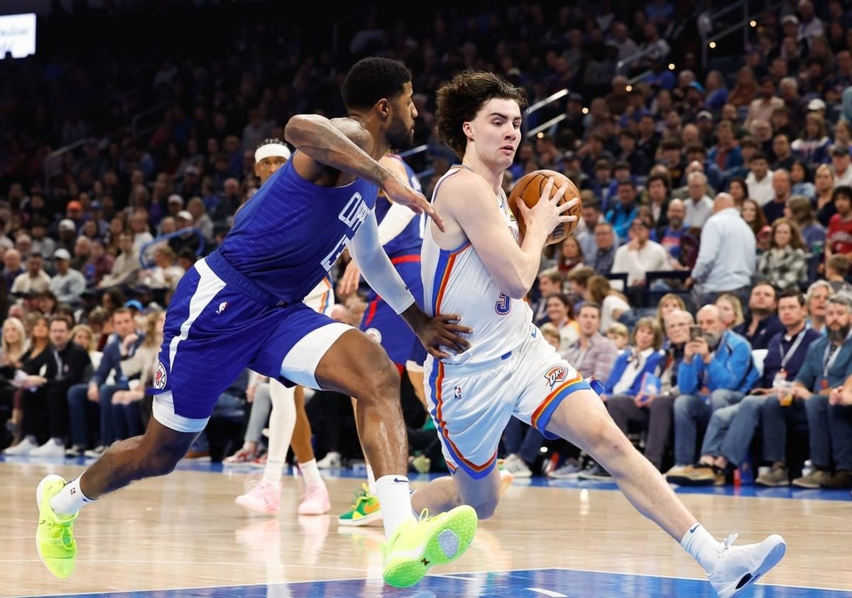 Dec 21, 2023; Oklahoma City, Oklahoma, USA; Oklahoma City Thunder guard Josh Giddey (3) drives past LA Clippers forward Paul George (13) during the second quarter at Paycom Center.