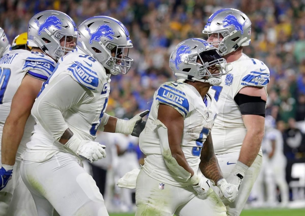 Detroit Lions running back David Montgomery (5) celebrates scoring a touchdown in the fourth quarter against the Green Bay Packers during their football game Thursday, September 28, 2023, at Lambeau Field in Green Bay, Wis.