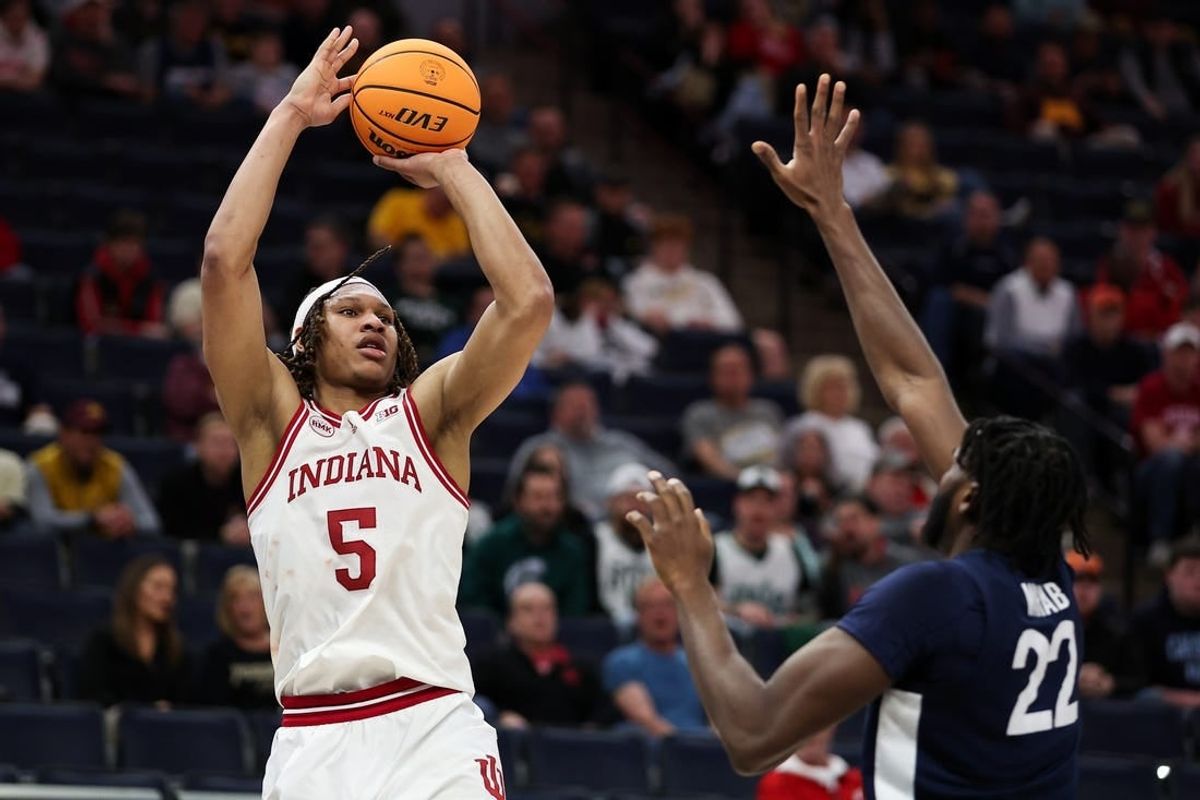 Mar 14, 2024; Minneapolis, MN, USA; Indiana Hoosiers forward Malik Reneau (5) shoots as Penn State Nittany Lions forward Qudus Wahab (22) defends during the first half at Target Center.