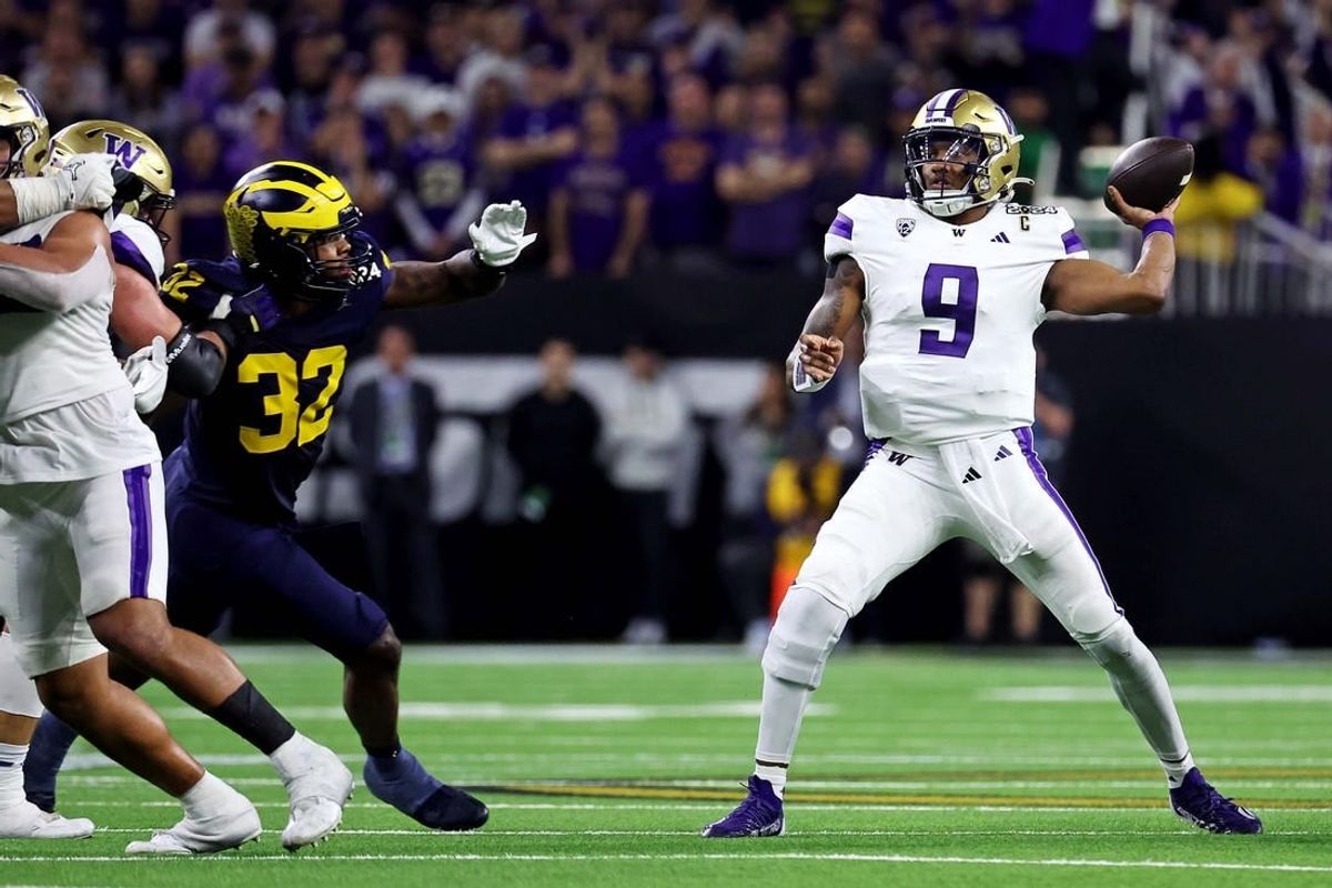 Jan 8, 2024; Houston, TX, USA; Washington Huskies quarterback Michael Penix Jr. (9) throws a pass against Michigan Wolverines linebacker Jaylen Harrell (32) during the fourth quarter in the 2024 College Football Playoff national championship game at NRG Stadium.