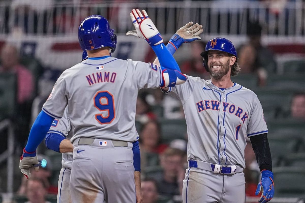 Apr 8, 2024; Cumberland, Georgia, USA; New York Mets left fielder Brandon Nimmo (9) reacts with second baseman Jeff McNeil (1) after hitting a home run against the Atlanta Braves during the fifth inning at Truist Park.