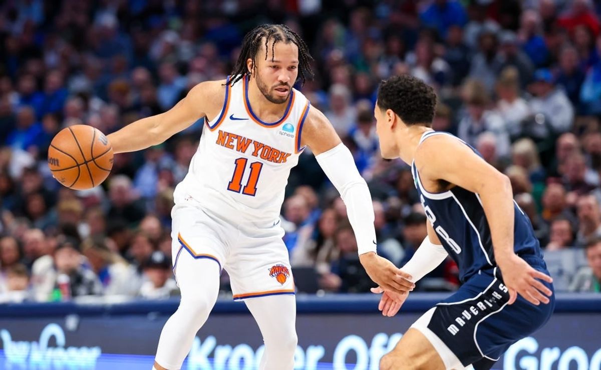 Jan 11, 2024; Dallas, Texas, USA;  New York Knicks guard Jalen Brunson (11) dribbles as Dallas Mavericks guard Josh Green (8) defends during the first half at American Airlines Center.
