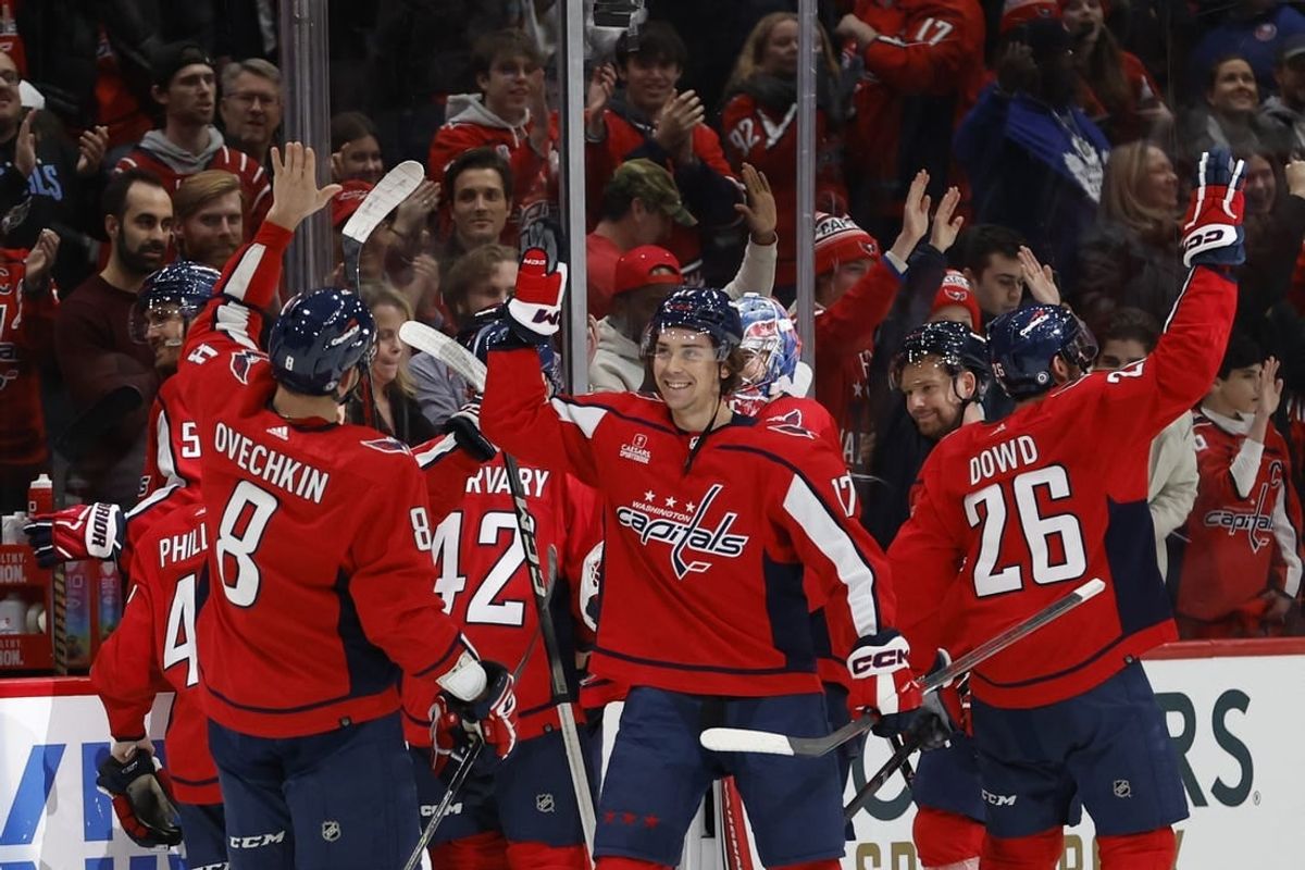 Dec 20, 2023; Washington, District of Columbia, USA; Washington Capitals center Dylan Strome (17) celebrates with Capitals left wing Alex Ovechkin (8) after scoring the game-winning goal on New York Islanders goaltender Semyon Varlamov (40) in overtime at Capital One Arena.