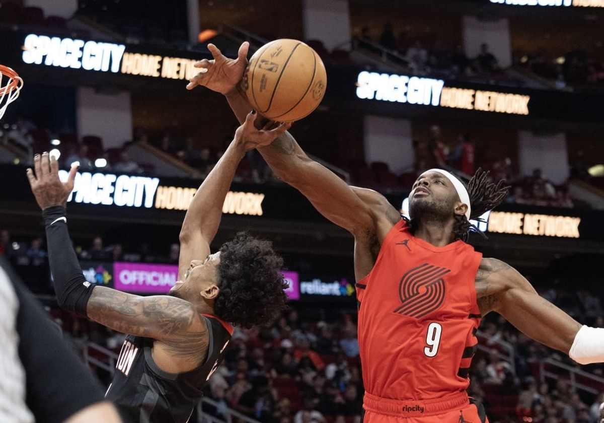 Jan 24, 2024; Houston, Texas, USA; Houston Rockets guard Jalen Green (4) is fouled by Portland Trail Blazers forward Jerami Grant (9) in the second quarter at Toyota Center.