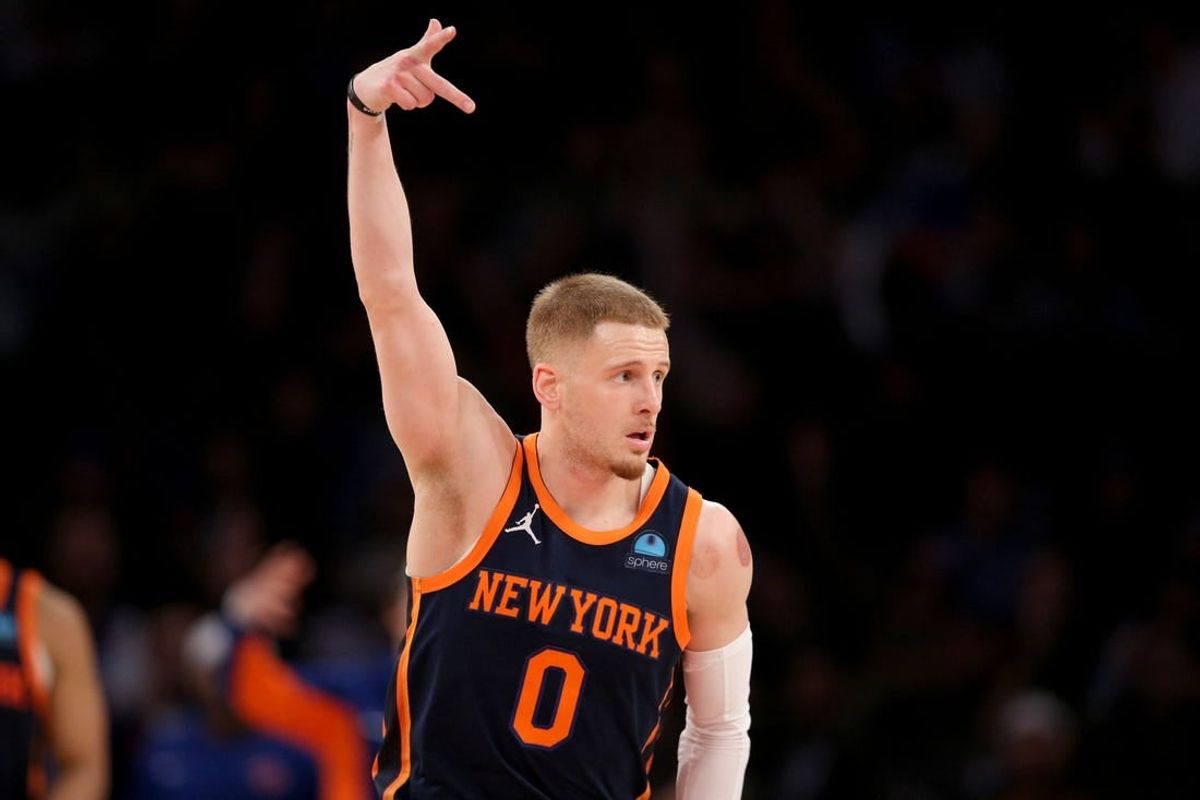 Jan 30, 2024; New York, New York, USA; New York Knicks guard Donte DiVincenzo (0) celebrates his three point shot against the Utah Jazz during the third quarter at Madison Square Garden.