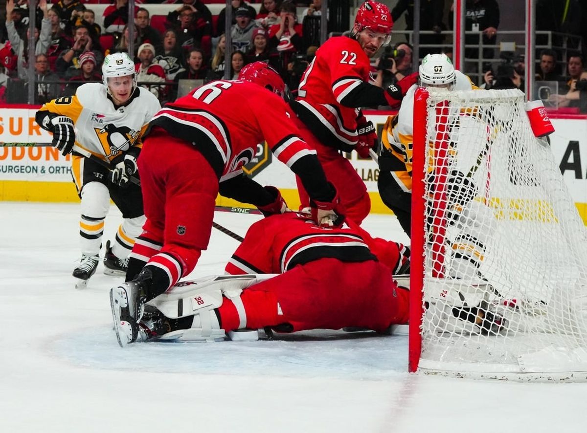 Jan 13, 2024; Raleigh, North Carolina, USA;  aCarolina Hurricanes goaltender Antti Raanta (32) stops the scoring chance by Pittsburgh Penguins right wing Rickard Rakell (67) during the second period t PNC Arena.