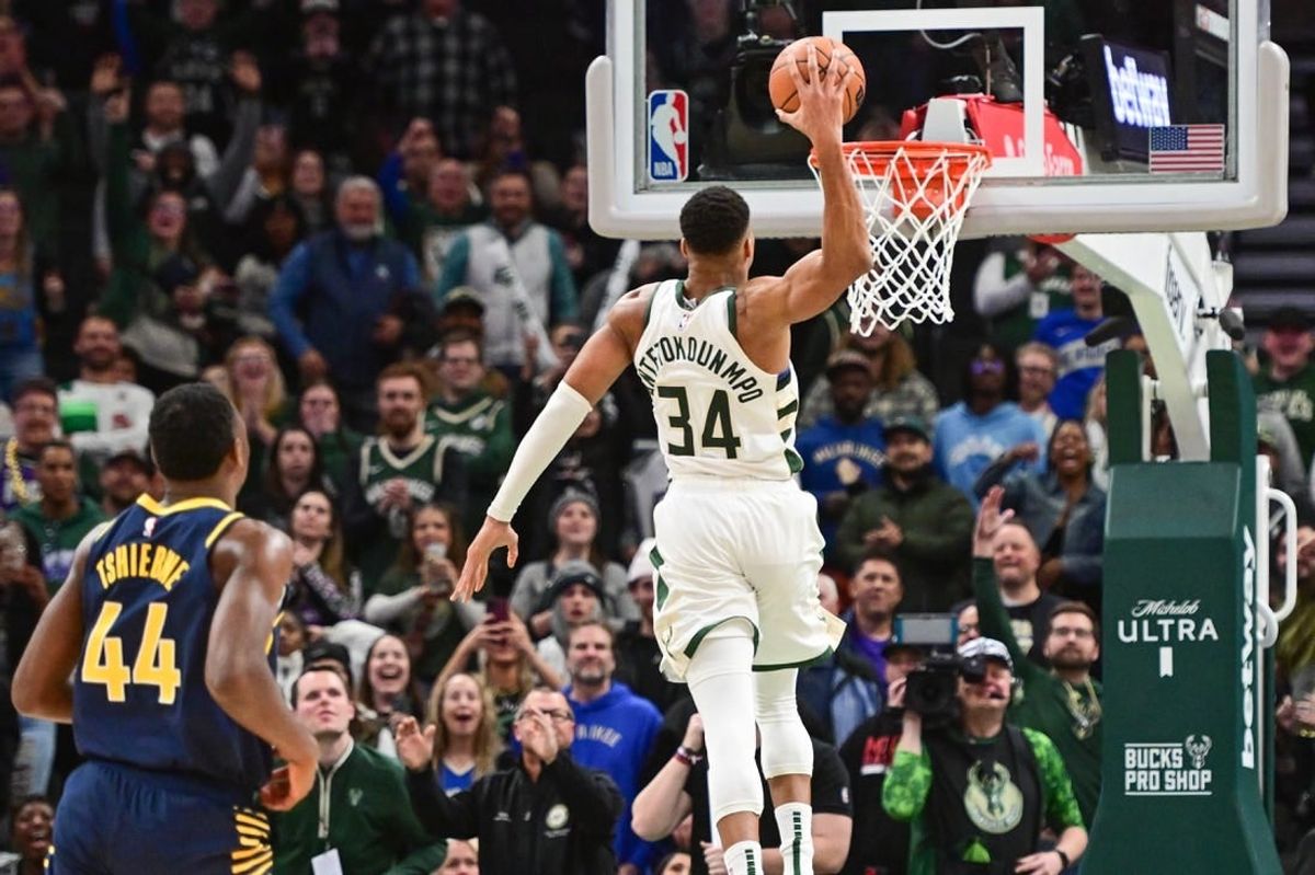 Dec 13, 2023; Milwaukee, Wisconsin, USA; Milwaukee Bucks forward Giannis Antetokounmpo (34) scores 64 points in the fourth quarter against the Indiana Pacers to set a team record for most points scored in a game at Fiserv Forum.