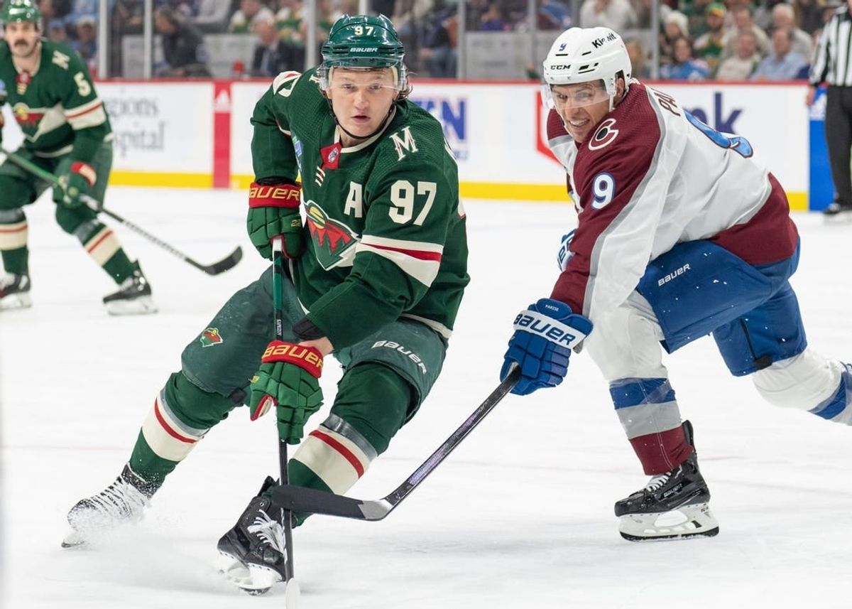 Apr 4, 2024; Saint Paul, Minnesota, USA; Minnesota Wild left wing Kirill Kaprizov (97) and Colorado Avalanche left wing Zach Parise (9) look for the puck in the third period at Xcel Energy Center.