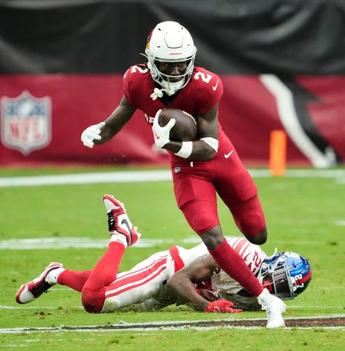 Sep 17, 2023; Glendale, AZ, USA; Arizona Cardinals wide receiver Marquise Brown (2) carries the ball past New York Giants safety Jason Pinnock (27) in the first half at State Farm Stadium.