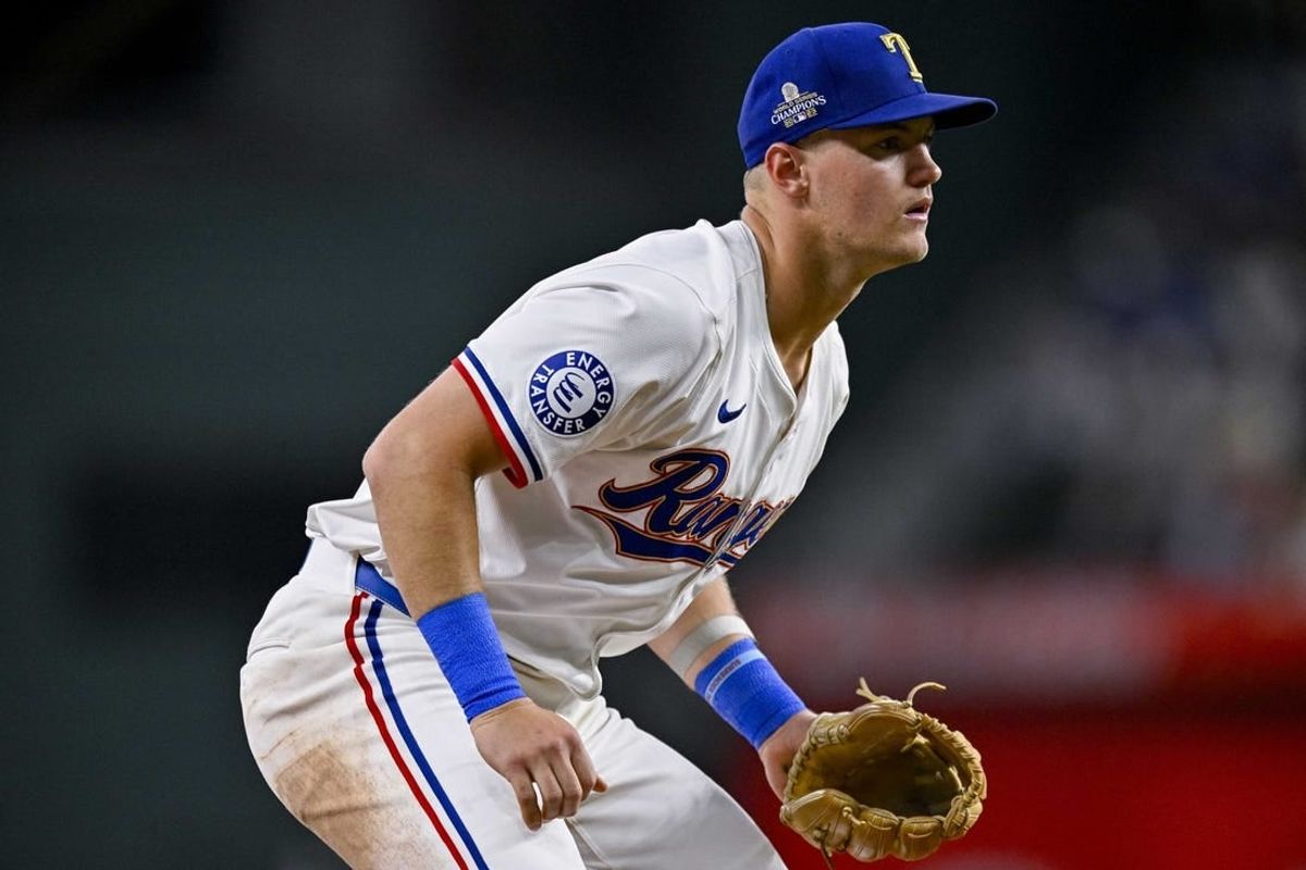 Mar 31, 2024; Arlington, Texas, USA; Texas Rangers third baseman Josh Jung (6) in action during the game between the Texas Rangers and the Chicago Cubs at Globe Life Field.
