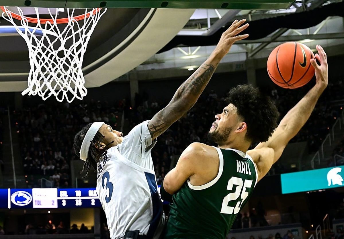 Jan 4, 2024; East Lansing, Michigan, USA; Michigan State Spartans forward Malik Hall (25) slams the ball home against Penn State Nittany Lions guard Nick Kern Jr. (3) during the second half at Jack Breslin Student Events Center.