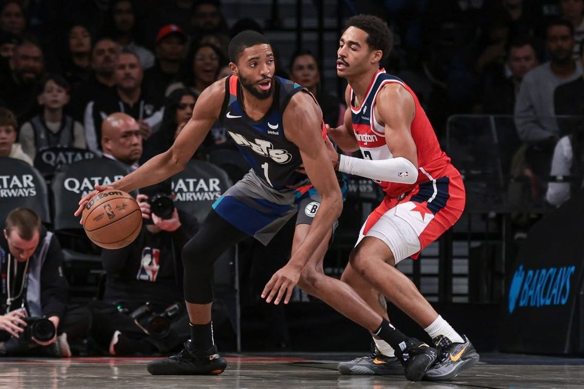 Nov 12, 2023; Brooklyn, New York, USA; Brooklyn Nets forward Mikal Bridges (1) dribbles against Washington Wizards guard Jordan Poole (13) during the second half at Barclays Center.