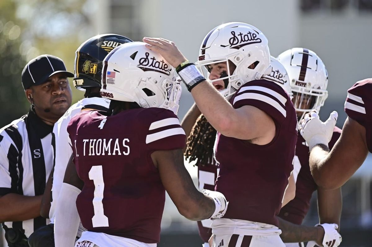 Nov 18, 2023; Starkville, Mississippi, USA; Mississippi State Bulldogs quarterback Will Rogers (2) reacts with  wide receiver Zavion Thomas (1) after a touchdown against the Southern Miss Golden Eagles at Davis Wade Stadium at Scott Field.