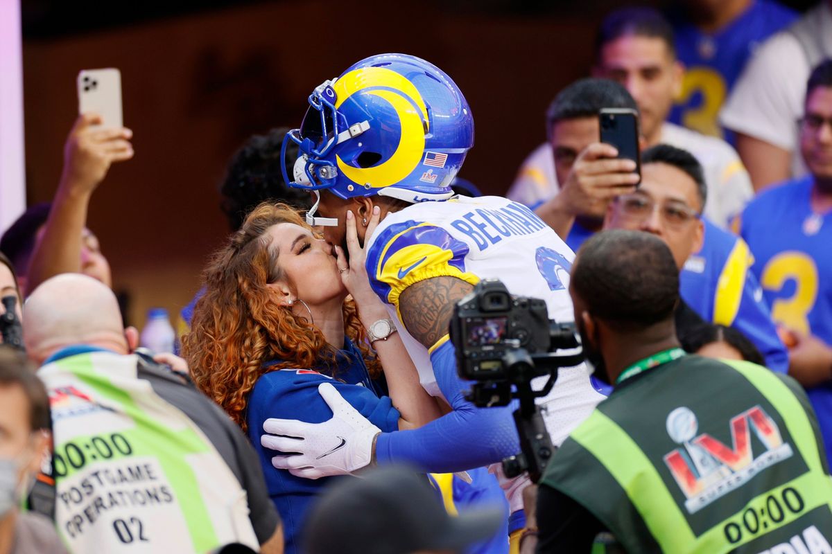 Odell Beckham Jr. kisses his girlfriend Lauren Wood, who is due to give birth to his first child.