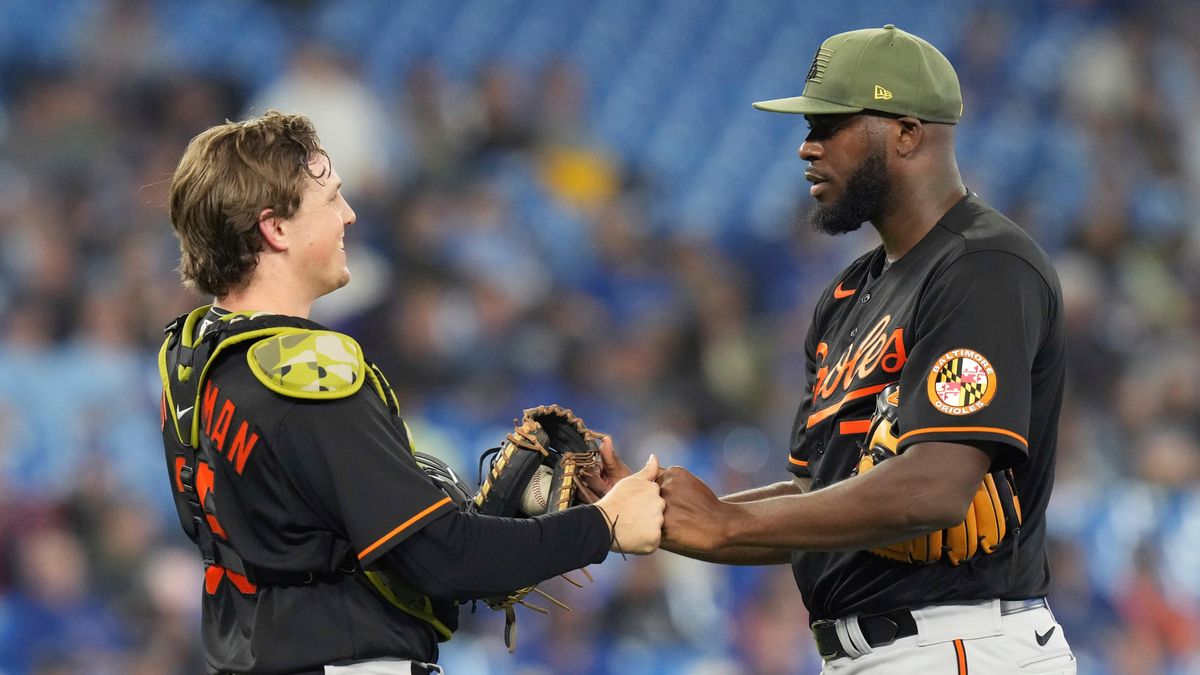 Adley Rutschman (left) and Felix Bautista celebrate an Orioles W.
