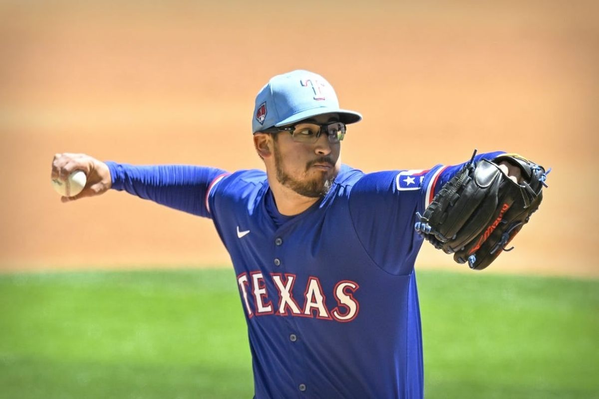 Mar 26, 2024; Arlington, Texas, USA; Texas Rangers starting pitcher Dane Dunning (33) pitches against the Boston Red Sox during the first inning at Globe Life Field.