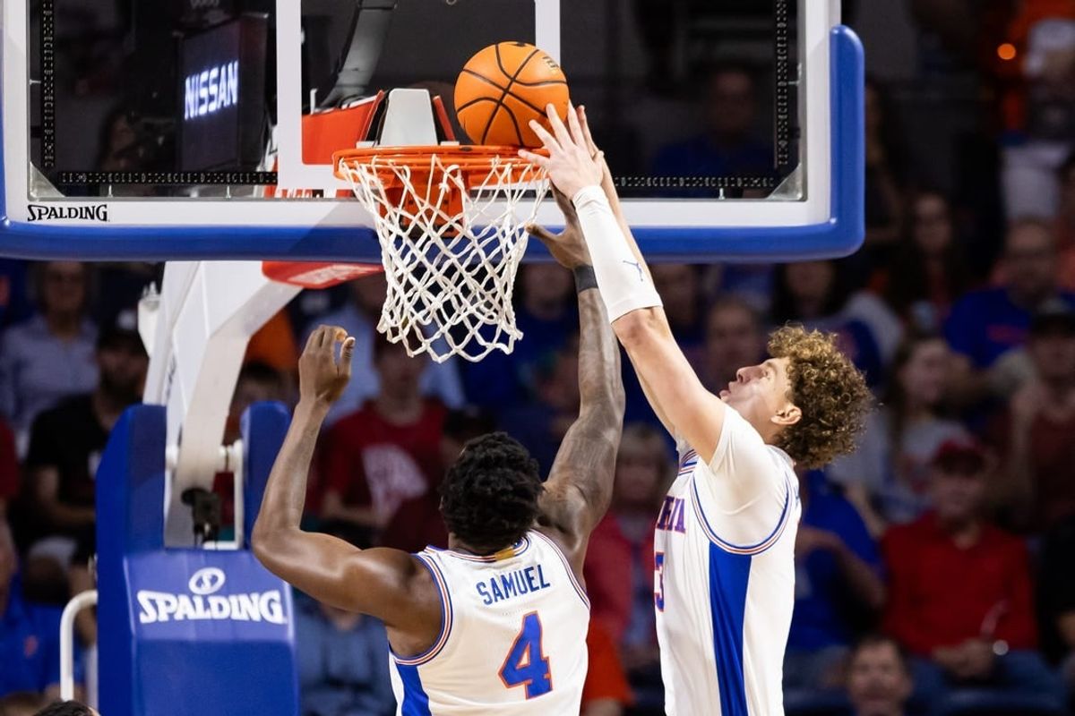 Jan 27, 2024; Gainesville, Florida, USA; Florida Gators center Micah Handlogten (3) dunks the ball against the Georgia Bulldogs during the first half at Exactech Arena at the Stephen C. O'Connell Center.