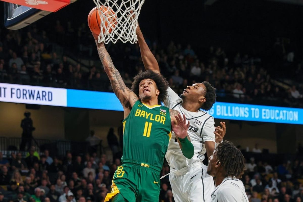 Jan 31, 2024; Orlando, Florida, USA; Baylor Bears forward Jalen Bridges (11) goes to the basket against UCF Knights forward Marchelus Avery (13) during the first half at Addition Financial Arena.