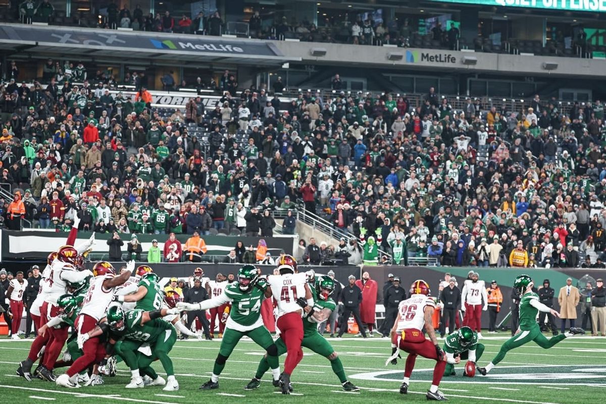Dec 24, 2023; East Rutherford, New Jersey, USA; New York Jets place kicker Greg Zuerlein (9) kicks the game winning field goal during the fourth quarter against the Washington Commanders at MetLife Stadium.