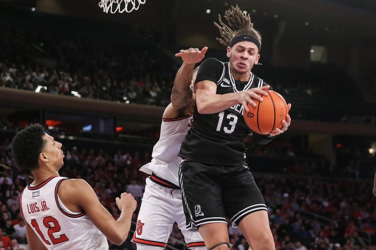 Jan 10, 2024; New York, New York, USA; Providence Friars forward Josh Oduro (13) grabs a rebound in the first half against the St. John's Red Storm at Madison Square Garden.