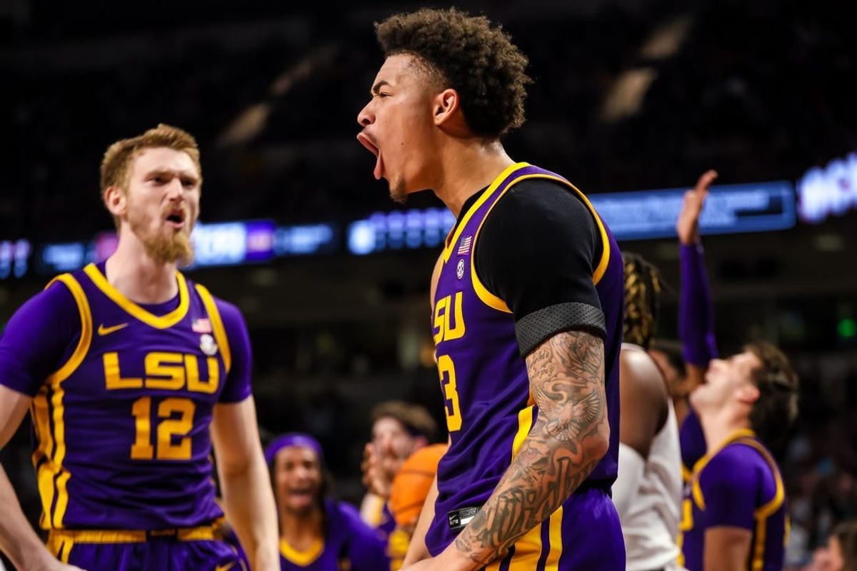 Feb 17, 2024; Columbia, South Carolina, USA; LSU Tigers forward Jalen Reed (13) celebrates a play against the South Carolina Gamecocks in the second half at Colonial Life Arena.