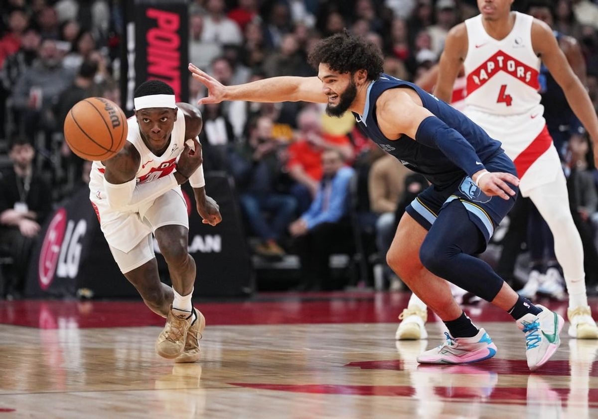 Jan 22, 2024; Toronto, Ontario, CAN; Toronto Raptors guard Dennis Schroder (17) battles for the ball with Memphis Grizzlies forward David Roddy (21) during the first quarter at Scotiabank Arena.