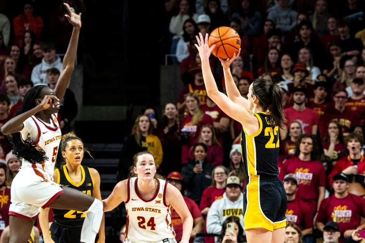 Iowa guard Caitlin Clark (22) scores her 3000th point during a basketball game at Hilton Coliseum on Wednesday, Dec. 6, 2023, in Ames.