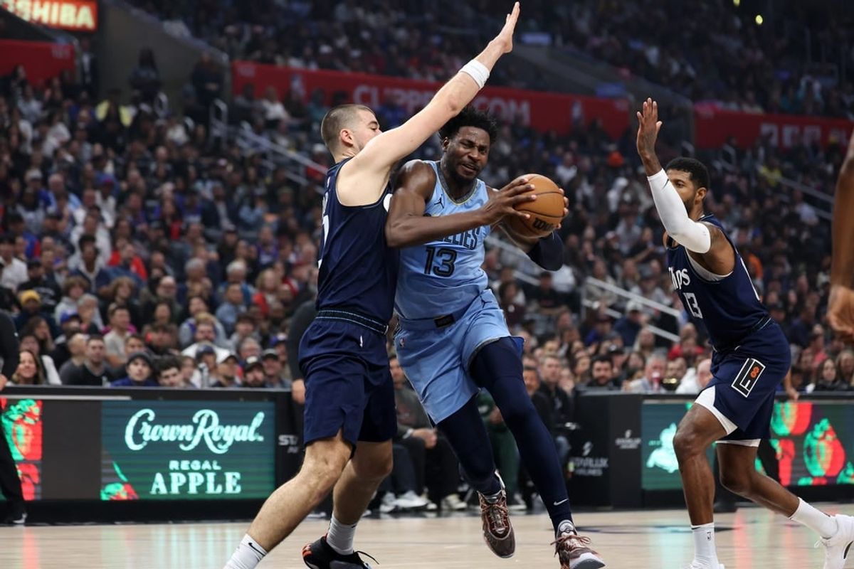 Dec 29, 2023; Los Angeles, California, USA;  Memphis Grizzlies forward Jaren Jackson Jr. (13) drives to the basket against Los Angeles Clippers center Ivica Zubac (40) during the first quarter at Crypto.com Arena.